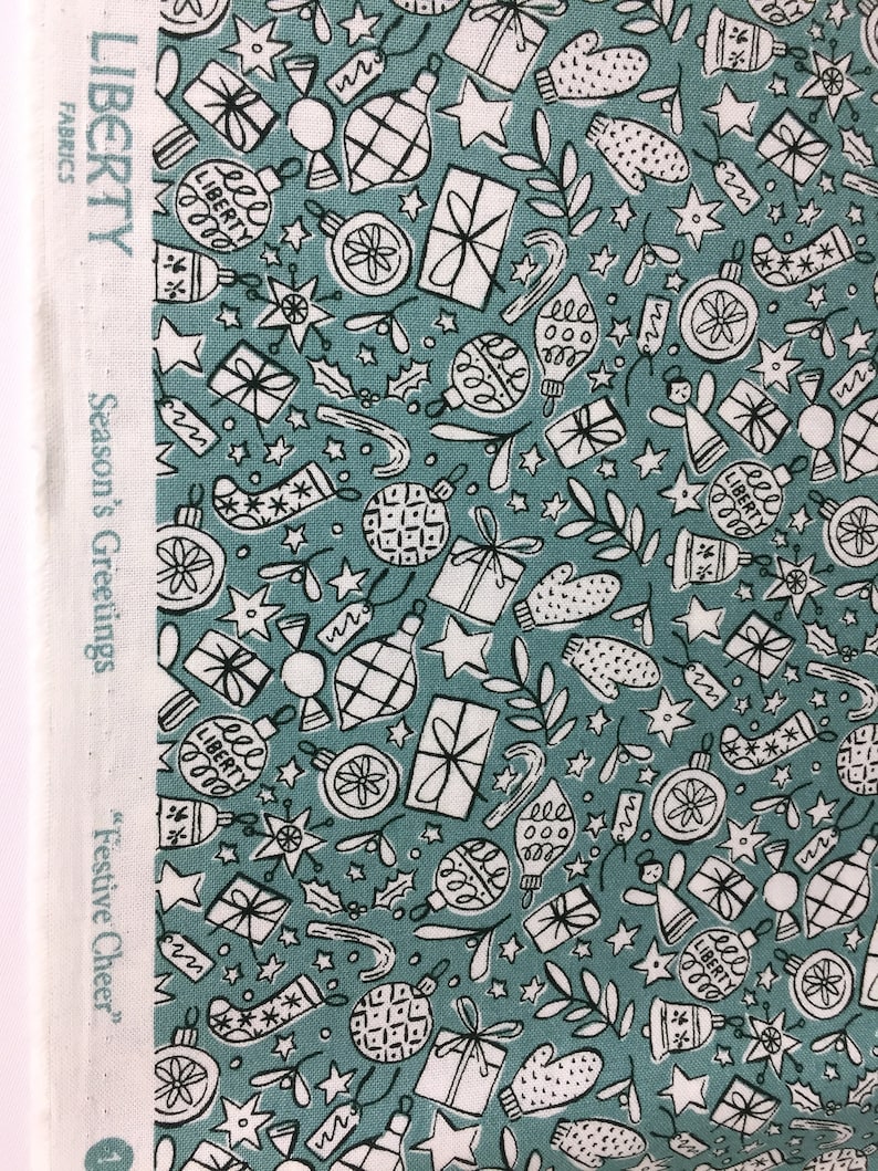 green Christmas fabric Festive cheer green cotton fabric from Liberty fabrics sold by the fat quarter and metre