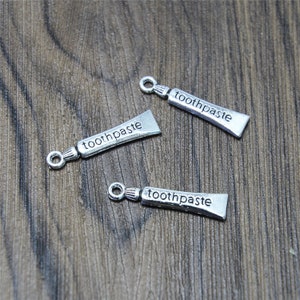 25 Stück Zahnpasta Charms Antike tibetische Silber Ton Zahnpasta Charms Anhänger 28 x 7 mm