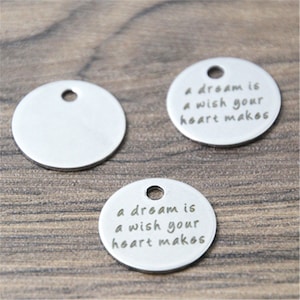 10 piezas Un sueño es un deseo que tu corazón hace Charms Colgante de acero inoxidable con mensaje de 20 mm
