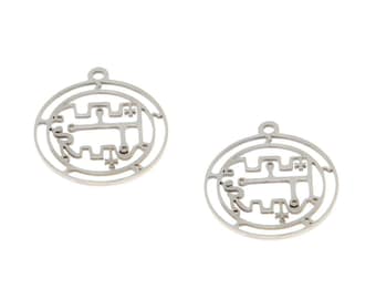 May include: Two silver metal charms with a circular design featuring a geometric pattern. The charms have a hole at the top for attaching to a necklace or bracelet.
