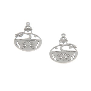 May include: A pair of silver earrings featuring a cut-out design of a bottle with an eye and stars. The earrings are made of metal and have a shiny finish.