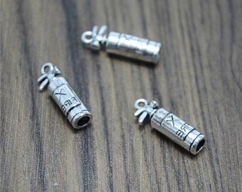 May include: Three silver-toned fire extinguisher charms with the word "FIRE" and a cross printed on them.