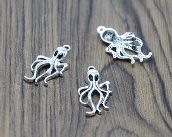 May include: Three silver octopus charms with a detailed design. The charms have a loop at the top for attaching to jewelry or other crafts.