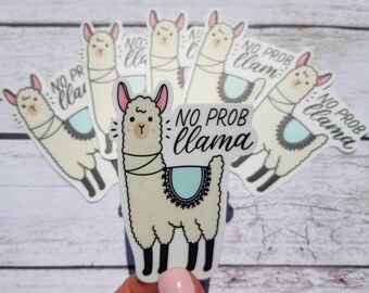 May include: A set of six white llama stickers with the text "No Prob Llama" in black script. The llamas are cartoon-style and have pink noses and hooves.
