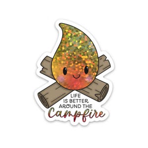 May include: A sticker with a cartoon campfire design. The flame is a glittery mix of orange, yellow, and green. Two brown logs are crossed beneath the flame. The text "LIFE IS BETTER AROUND THE CAMPFIRE" is written below in a decorative font.