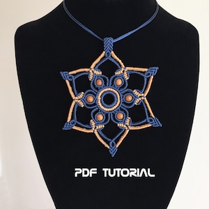 May include: A blue and brown macrame necklace with a star-shaped pendant and wooden beads. The pendant is a geometric design with a central circle. The necklace is on a black mannequin bust. The text "PDF TUTORIAL" is printed below the pendant.
