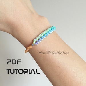 PDF pattern to fine micro-macrame flower shapes bracelet in rainbow color with orange strap.