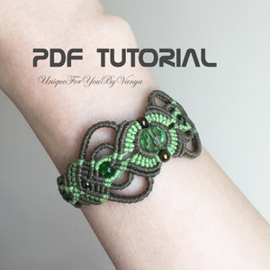 May include: A green and brown macrame bracelet with green glass beads. The bracelet is on a person's wrist. The text "PDF TUTORIAL Unique For You By Vanya" is above the bracelet.