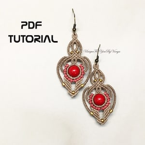 May include: A pair of beige and red macrame earrings with a red stone bead in the centre of each earring. The earrings are hanging from a silver hook. The text "PDF TUTORIAL" is in the top left corner of the image. The text "Unique For You By Vanya" is in the top right corner of the image.