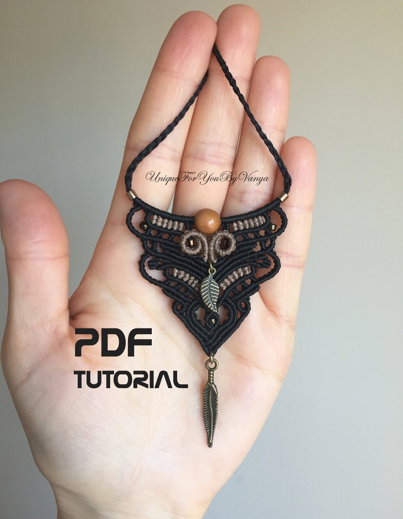 PDF pattern on black and light brawn micro-macrame bohemian necklace with wooden bead at the middle top with two metal leafs charms. One attached at the middle of the necklace and the other at the bottom.