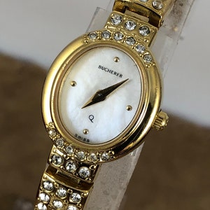 Vintage 1980&#39;s Bucherer Ladies Wrist Watch 18K Gold Plated Wrist Watch, Oval Bezelwith 14 Links and 144 Czechoslovakian Crystals Settings