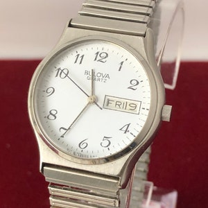 Vintage 1980 Bulova Quartz Watch: Silver Tone Day Date Stainless Steel