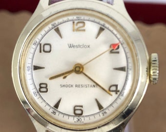 Vintage 1950's Westclox Swiss Gold Tone watch with White Dial Gold Hands, Red sweeping second hand works, in great condition