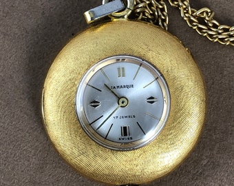 Vintage La Marque 17 Jewel Swiss Made Pendant Watch Swirling Brocading on both sides comes with 24 inch Vermeil Rope Necklace