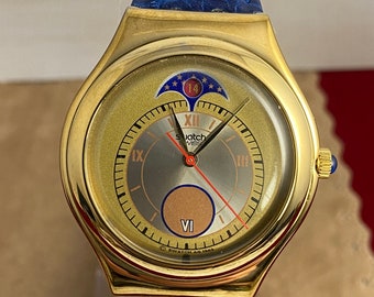 Stunning Gold Case and Blue Leather Embossed 9 inch Strap 1993 Swiss made Swatch Moon Date Watch