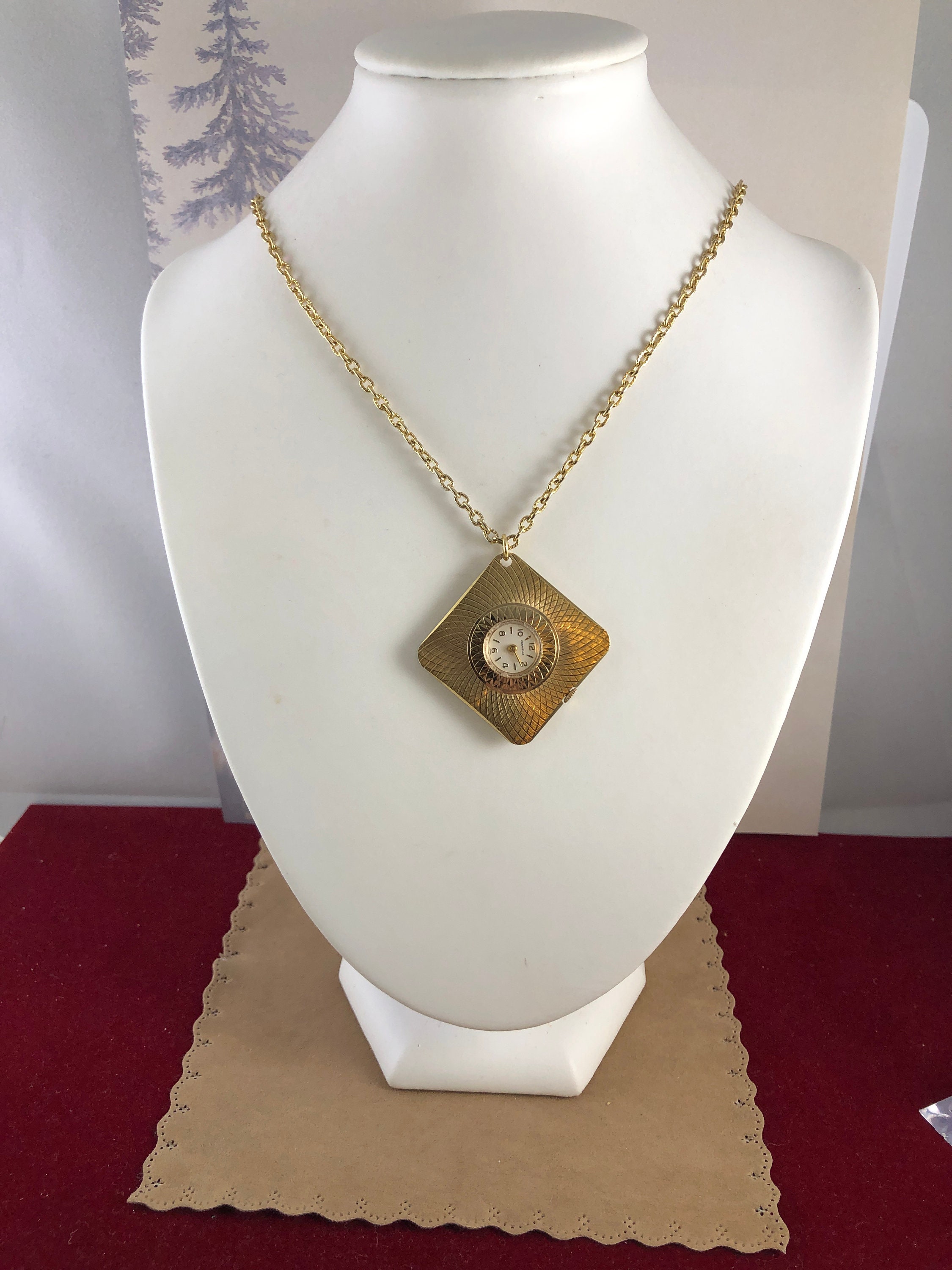 Vintage Caravelle Pendant Watch: Gold Tone Brocade, 7 Jewel 