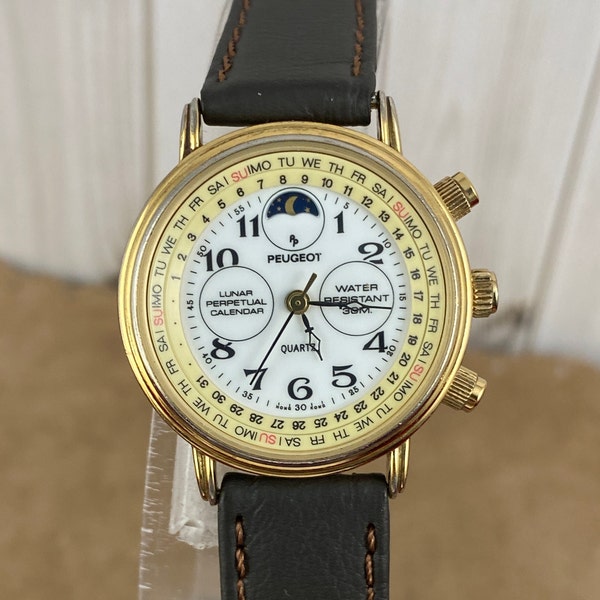 Vintage Peugeot Old Fashion Swiss Quartz Perpetual Calendar Moon Phase Watch with Arabic Numeral Hour Markers in a 1.125 inch diameter