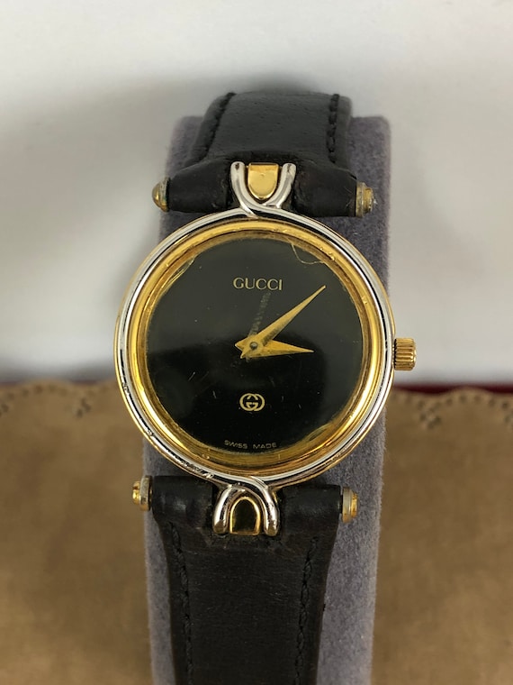 vintage black and gold gucci watch