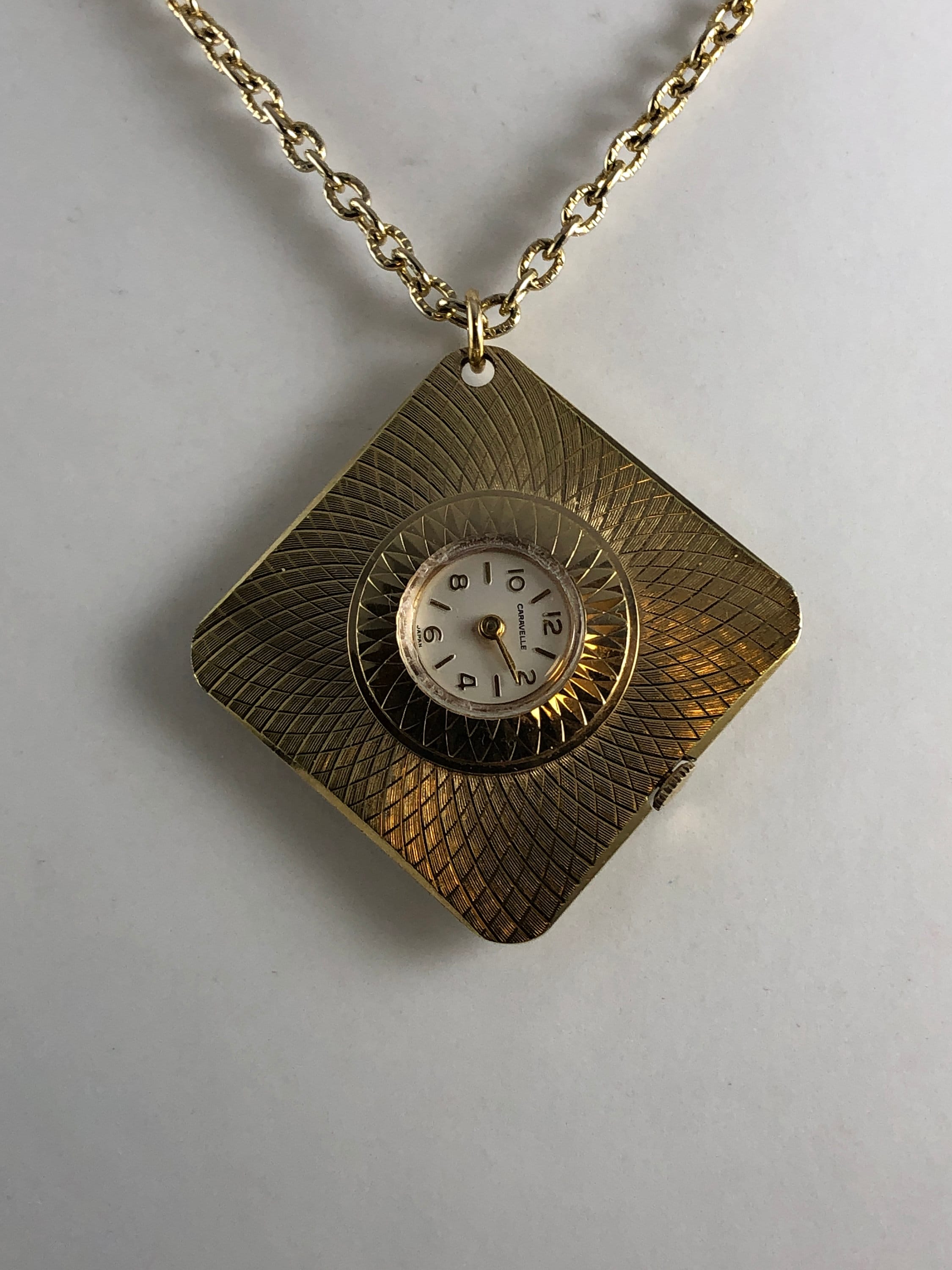 Vintage Caravelle Pendant Watch: Brocaded Gold Tone Oval 7 Jewel Mechanical Vintage Caravelle Pendant Watch: Gold Tone Brocade, 7 Jewel  main image 2