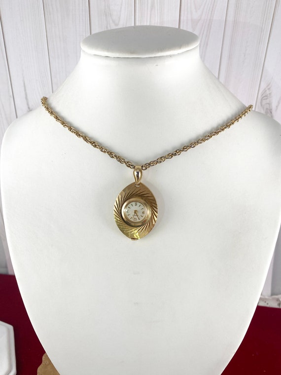 Vintage Caravelle Pendant Watch: Brocaded Gold Tone Oval 7 Jewel Mechanical Caravelle | Accessories | Vintage Caravelle Pendant Watch  main image 4