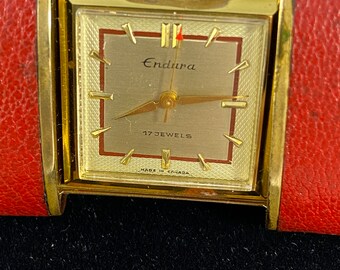 Vintage 1950s Endura 17Jewel Gold Tone MechanicalBrown Lizard Skin Purse Watch s_wp_63a66c144bc6555188f7d8ef.webp main image 3