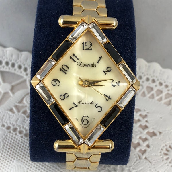 Vintage Ladies Xanadu gold tone Diamond shape with Black and Clear set Crystal on all sides quartz watch beveled crystal oyster shell dial