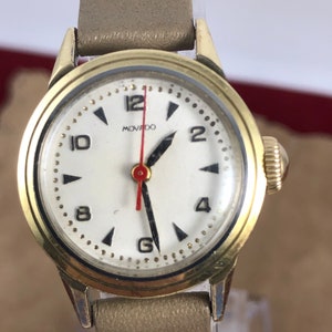 Movado Vintage Watch 1950&#39;s early 1960&#39;s Hand Wind, 2 Tone Case & Gold Plated Bezel Mechanical keeps time NOS Movado 8 inch Tan Strap