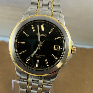 Vintage SEIKO Quartz Japan Movement 2 Tone Gold and Silver Face Gold Sweeping Hands