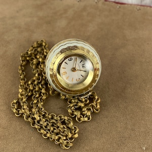 Vintage Caravelle Almost New Condition 7 Jewel Pendant Watch Diamond Cut Orb Shape with White Enamel  24 In Necklace