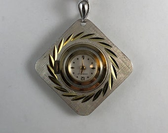 Vintage Caravelle 7 Jewel Gold and Silver Tone Pendant Watch in Brocaded Sprial Diamond Cut Front Design Mechanical Hand Wind Watch