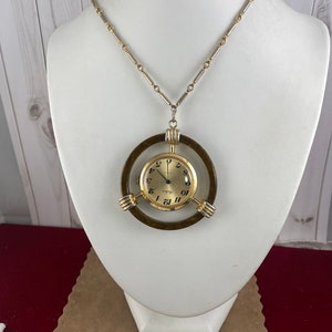 Vintage Belair 12K gold Plated Pendant Watch 2.25 inches in diameter with a great vintrage 24 inch necklace