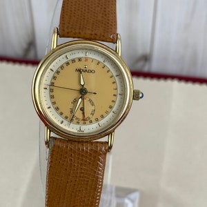 Vintage Movado Watch 1970s Case 20 Microns 18K Gold Plating, Day and Date, Stainless Steel Back, and New Brown Leather Strap Gold Dot Buckle
