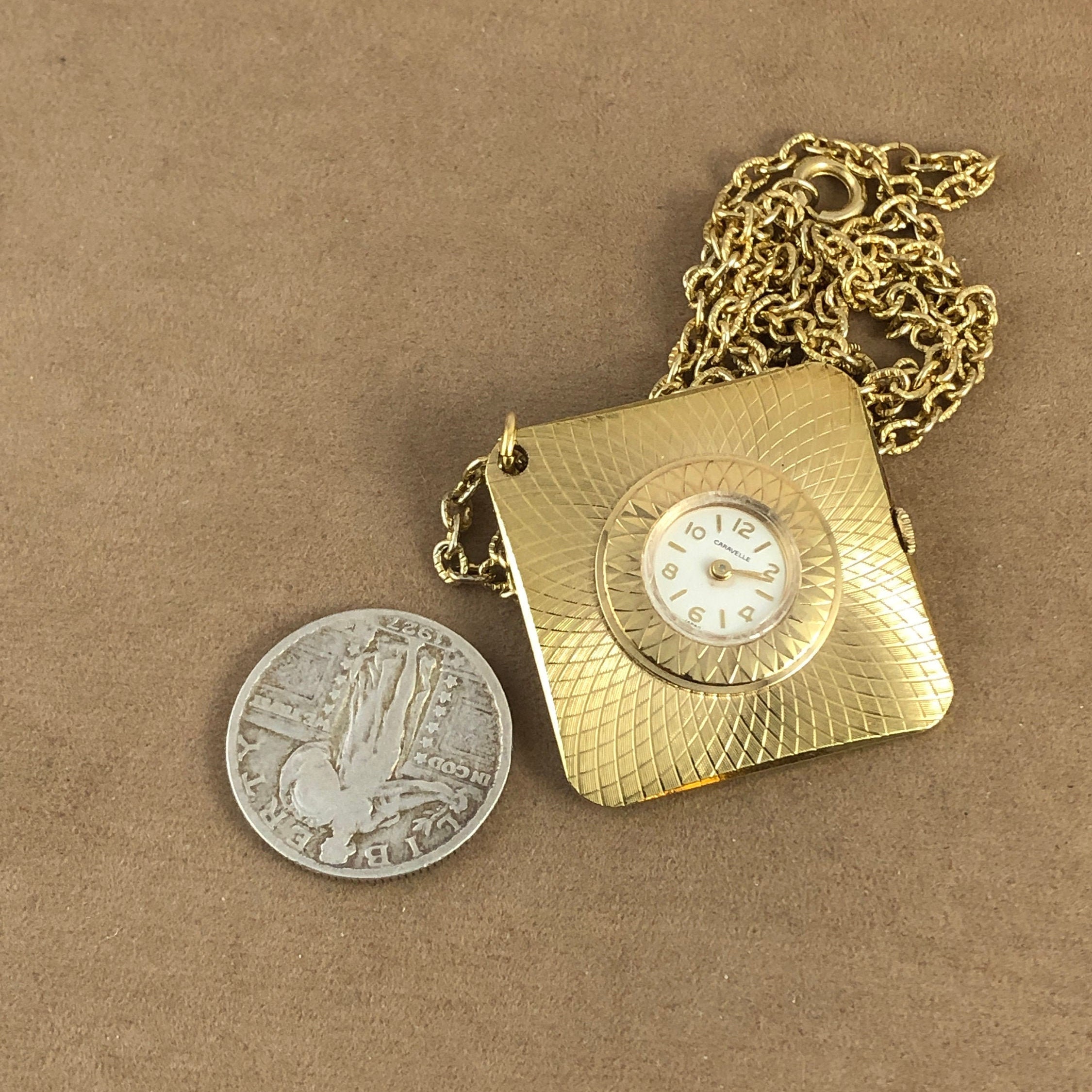 Vintage Caravelle Pendant Watch: Brocaded Gold Tone Oval 7 Jewel Mechanical Vintage Caravelle Pendant Watch: Gold Tone Brocade, 7 Jewel  main image 3