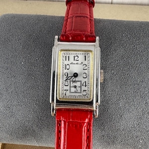 Vintage Rare Eddie Bauer 70Th Anniversary Tank Watch Silver Tone, with Red Strap and a nice Japan movement