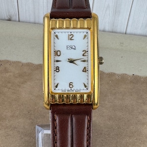 Vintage and Rare Gold Movado Esquire Sculptured Tank with Curvature Case White Enamel Dial/