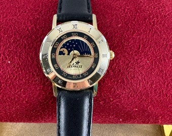 Reloj vintage LA Express con fase lunar en tono dorado y números romanos