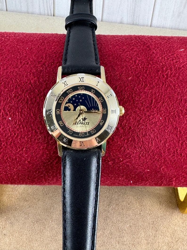 Vintage LA Express Gold tone moonphase watch with Roman Numerals image 1