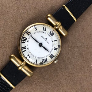 Vintage Bucherer Mechanical Watch: Swiss Made, Roman Numerals, Black Leather Strap