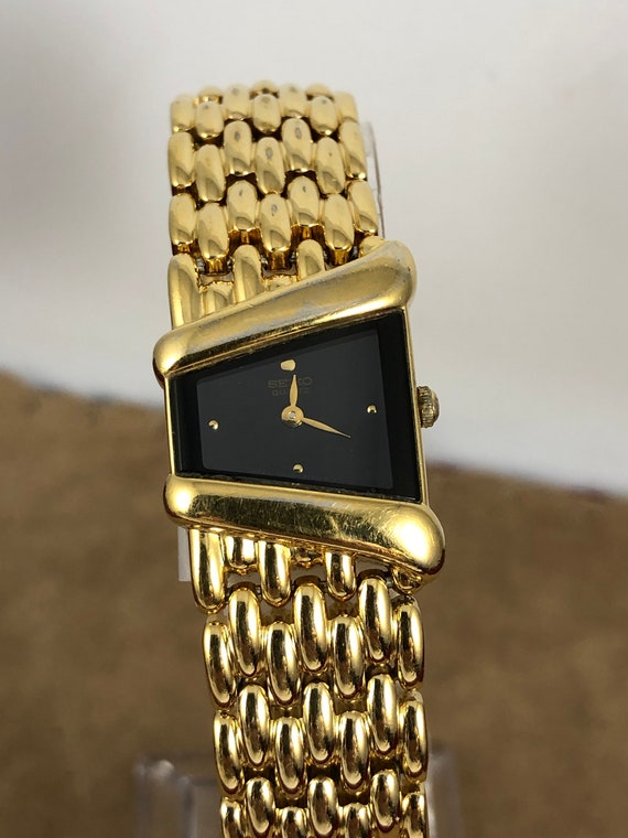 seiko gold watch with black face