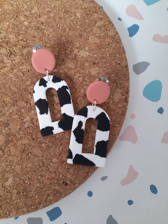 Polymer clay cow print clip on earrings