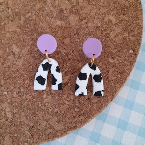 Polymer clay cow print mini arch earrings