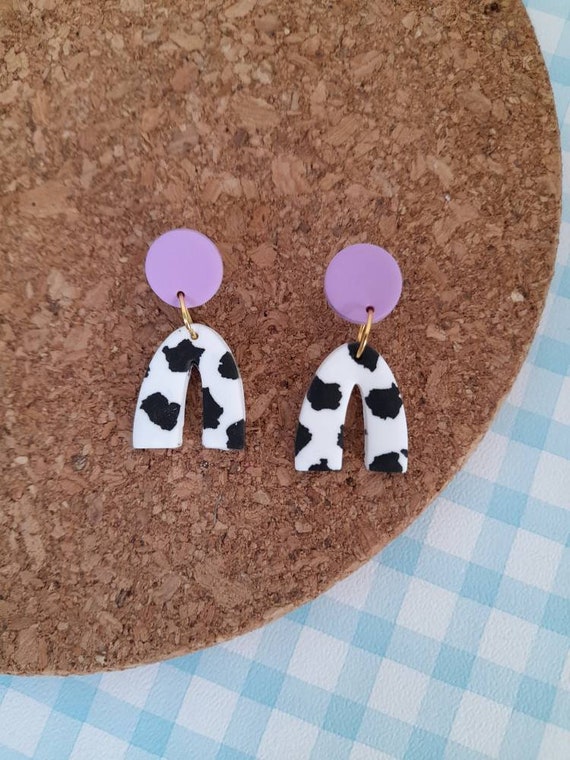 Polymer clay cow print mini arch earrings