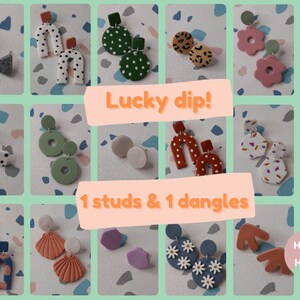 May include: A collage of 12 pairs of handmade polymer clay earrings. The earrings are in various shapes, colors, and patterns. The text "Lucky dip! 1 studs & 1 dangles" is in the center of the collage. The text "House of Hetty" is in the bottom right corner of the collage.