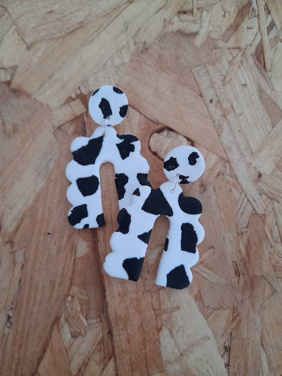 Cow print bubble arch dangle earrings made from polymer clay