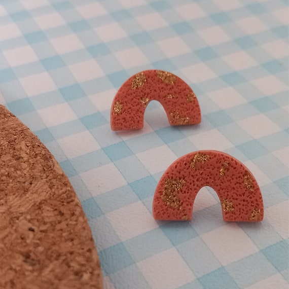 Small textured rainbow shaped polymer clay stud earrings with gold detail
