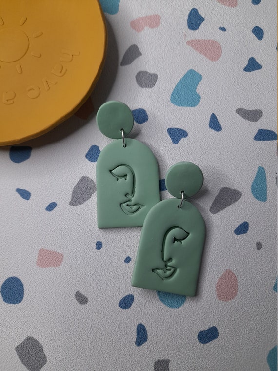 Polymer clay green abstract face arch earrings