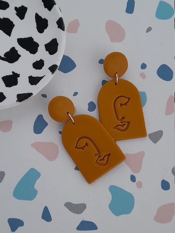 Polymer clay mustard yellow abstract face arch earrings