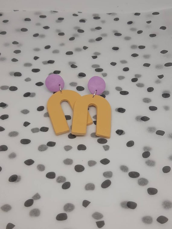 Polymer clay pale yellow and lilac dangle arch earrings