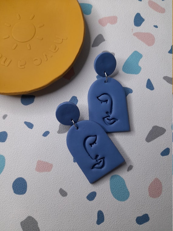 Polymer clay blue abstract face arch earrings