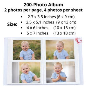 May include: A white photo album with four baby photos visible. The album's text reads "200-Photo Album" and lists photo sizes: 2.3 x 3.5 inches, 3.5 x 5.1 inches, 4 x 6 inches, and 5 x 7 inches. Each page holds two photos.